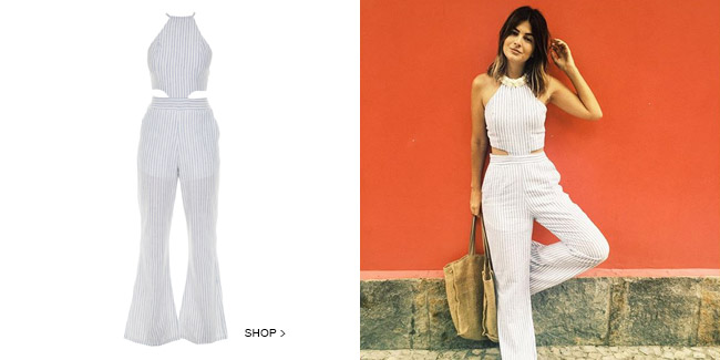 Designer Lu Botto usando macacão feminino braco com riscas pretas vendida no Gallerist